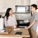 Roommates having a Conversation in the Kitchen
