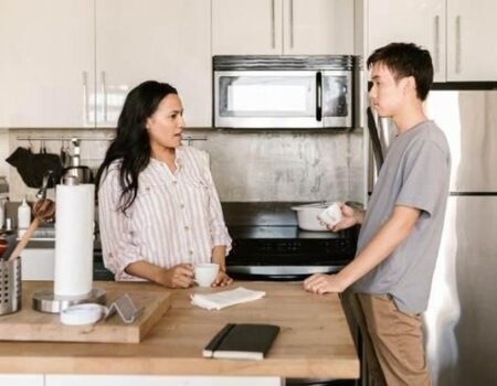 Roommates having a Conversation in the Kitchen