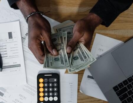 a man counting money and making plans
